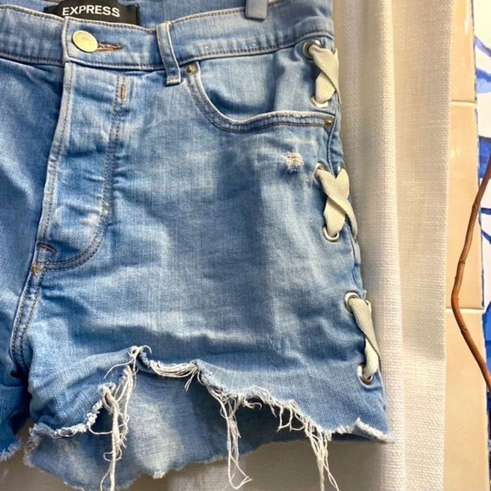 Women’s Express Shortie Vintage High Rise Button-fly Distressed Blue Jean Shorts